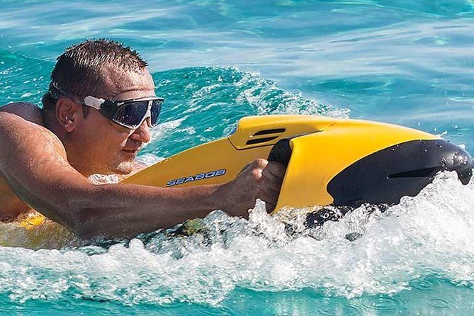 Rider relaxing on a Seabob float in clear Caribbean water
