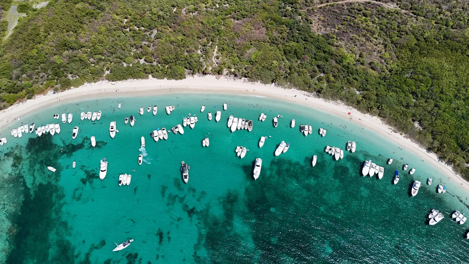 Aerial drone shot of Flamenco Beach arc Culebra Puerto Rico with boats anchored