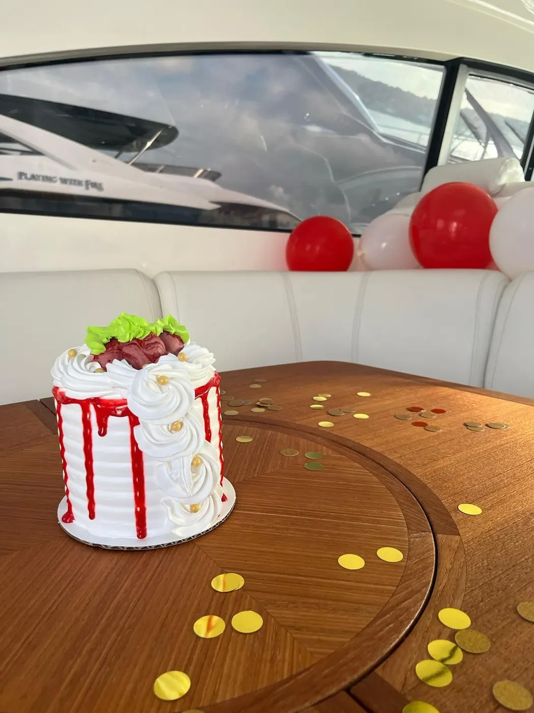 Real festive balloon and cake setup styled by Boating Puerto Rico